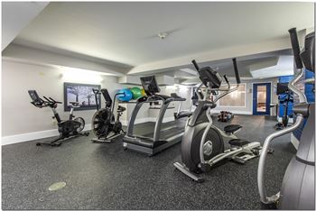 a room filled with lots of different types of exercise equipment